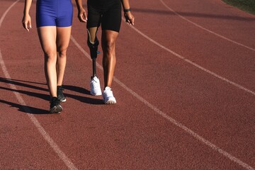 Fototapeta premium Two athletes walking on a running track