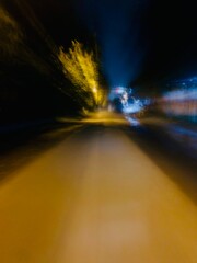 blurry photo of a quiet street at night, dreamy blurred effect