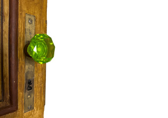 Vintage Green Glass Door Knob on Wooden Surface