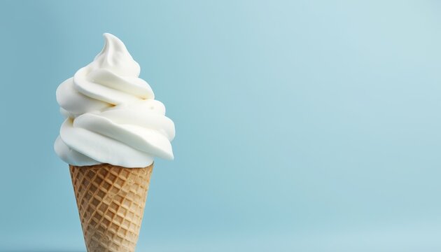 A delicious vanilla soft serve ice cream cone on a blue background.