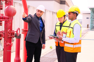 Engineers check fire extinguishing system valves in buildings and industrial plants.