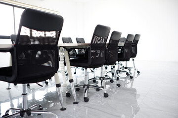 Black chairs in the conference room.