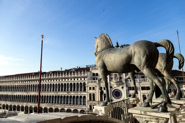 View of the Horses of Saint Mark in St Mark's Square on a beautiful sunny day. The Procuratie...