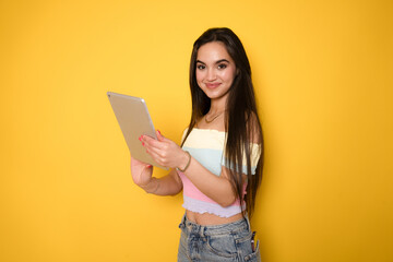 Smart intelligent caucasian hispanic latin-american young woman student using digital tablet...