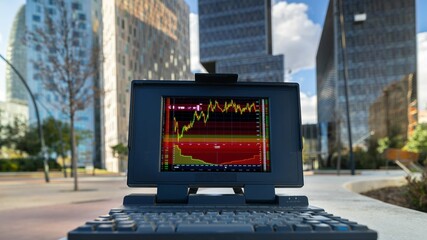computer with city skyscraper skyline and code and data on screen - 801246952