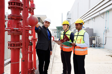 Engineers check fire extinguishing system valves in buildings and industrial plants.