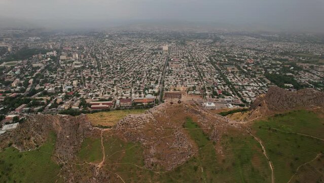 Aerial view of Osh city, Sacred Mountain Sulaiman Too in city centre. Beautiful powerful mountain.