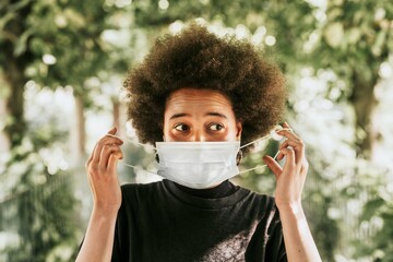 Woman wearing surgical mask in public