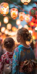 Two young girls wearing kimonoæµ´è¡£at a Japanese summer festival