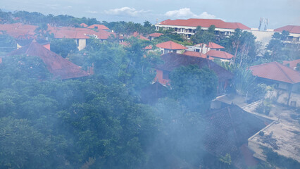 aerial view of village in Bali with haze or morning dew