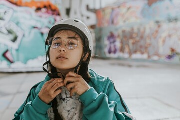 Female skate wearing white helmet