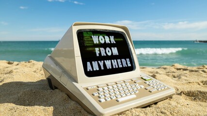 computer on a beach with words work from anywhere on screen - 801270380