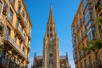 Fototapeta premium Majestic New Gothic Cathedral Towering Over the City Streets on a Sunny Day, San Sebastián Donostia, Spain