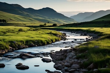 Fototapeta premium A river flowing through a valley with green hills in the background