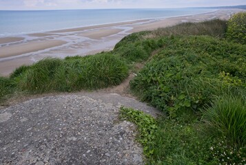Vierville-sur-Mer, France - Apr 23, 2024: Omaha Beach D-Day. View from the western hill. Cloudy...