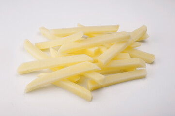 raw potato cut into strips on white background