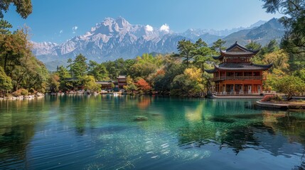 Obraz premium Landscape featuring Black Dragon Pool and a classical Chinese pagoda, set against the majestic Jade Dragon Snow Mountain surrounded by lush greenery.