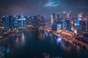 Fototapeta na wymiar A dazzling, night-time panorama of Singapore's bustling cityscape and local attractions