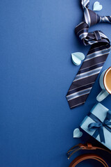 Beautifully curated Father's Day scene featuring a classic tie, coffee cup, and gift box, offering ample space to write heartfelt wishes or greetings