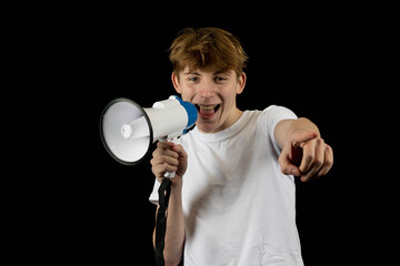 A teenage male holding a megaphone
