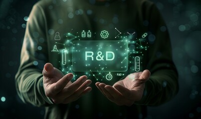 A man is holding a green screen with the letters R&D on it