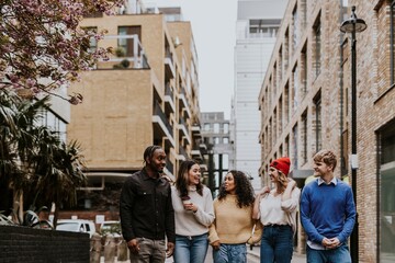 Diverse friends hanging out in city