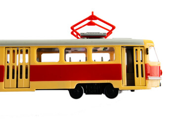 Old Czech red tram isolated on white background. A toy replica of a tram.