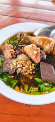 Chicken noodles in a bowl, Thai style