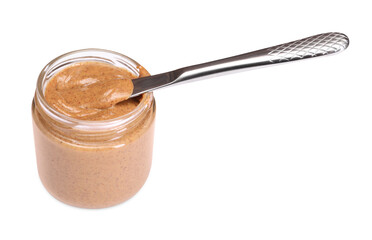 Tasty nut paste in jar and knife isolated on white