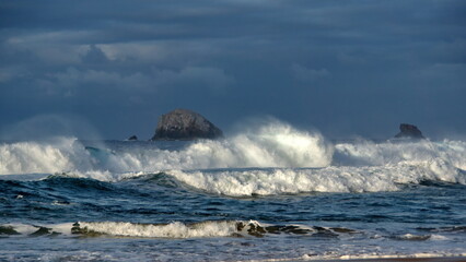 Waves in front of an islet just off the beach in Zipolite, Mexico
