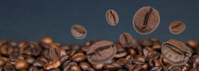 Falling coffee beans. Flying defocused coffee beans. Used for cafe advertising, packaging, menu design. Banner.