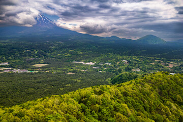 Fototapeta premium Aerial view of a cloud covered Mount Fuji and the 