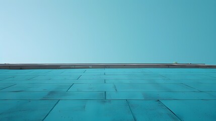 Obraz premium Minimalist Blue Building With Reflective Pool and Clear Sky