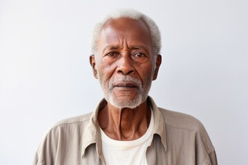 Obraz premium Portrait of a tender afro-american man in his 80s sporting a breathable hiking shirt in modern minimalist interior