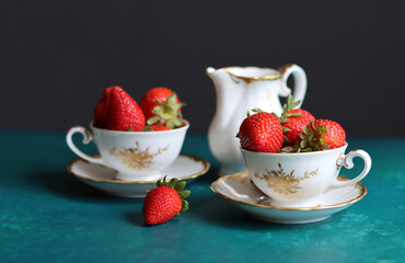 Seasonal fruit close up photo. Juicy red strawberry on a table. Eating fresh concept. 