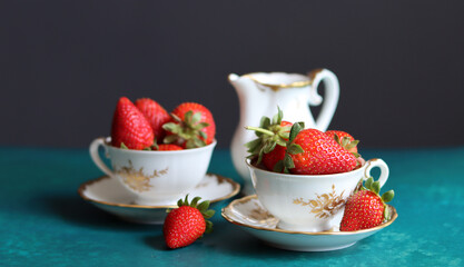 Seasonal fruit close up photo. Juicy red strawberry on a table. Eating fresh concept. 