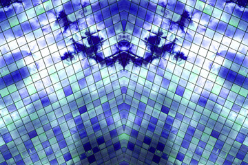 Vidraça de prédio com vidro de cor azul e forma geométrica de cubo. 