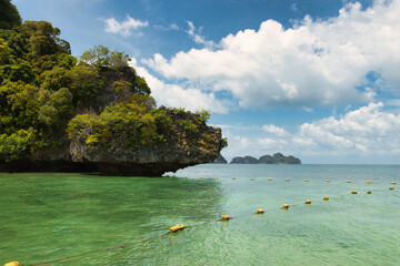 Koh Lao Lading or Koh Lao Rakhing ( Lao Lading Island ) is small island offering picturesque white-sand shores and swimming coves surrounded by limestone cliffs, Krabi Thailand. 14.7.23