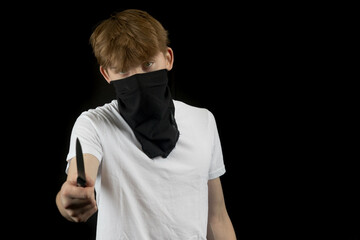 A Teenage Mugger holding a knife