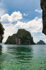 Koh Lao Lading or Koh Lao Rakhing ( Lao Lading Island ) is small island offering picturesque white-sand shores and swimming coves surrounded by limestone cliffs, Krabi Thailand. 14.7.23