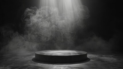 A spotlight shines down on a dark, smoky stage.