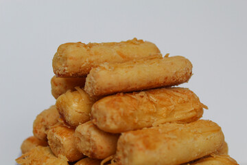 Kaasstengels or Kastengel, is Dutch influenced Indonesian cheese cookies in the form of sticks. Isolated in white background