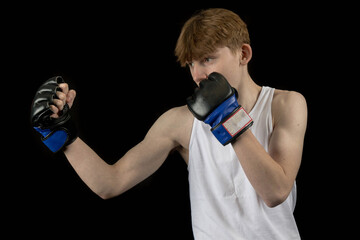 A Teenage Male Boxer and Black Background