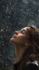 A woman standing in the rain with her eyes closed