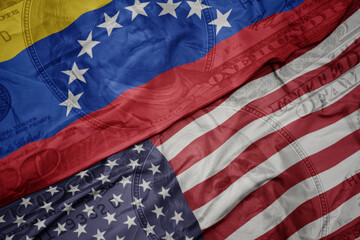 Obraz premium waving colorful flag of united states of america and national flag of venezuela on the dollar money background. finance concept.
