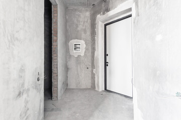 interior of the apartment without decoration in gray colors. rough finish