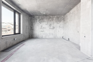 interior of the apartment without decoration in gray colors. rough finish