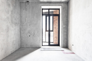 interior of the apartment without decoration in gray colors. rough finish