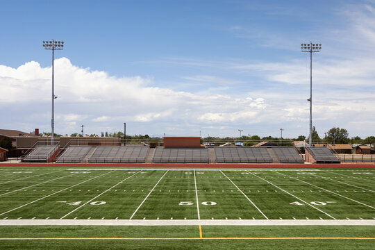 Empty football field and bleachers