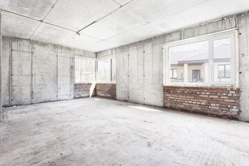 interior of the apartment without decoration in gray colors. rough finish